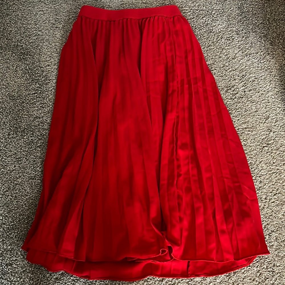 Long, red pleated skirt
